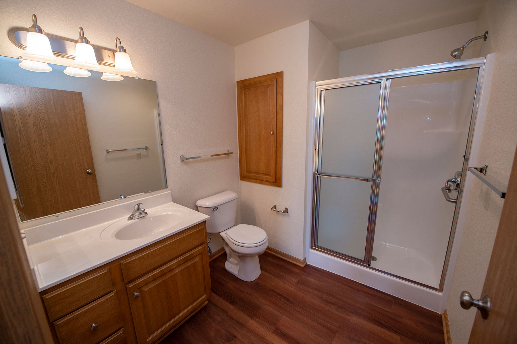 a bathroom with a shower toilet and sink