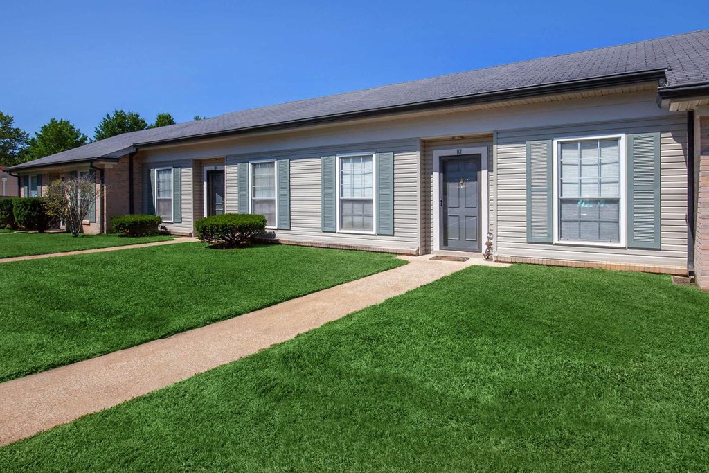 a house with a lawn in front of it