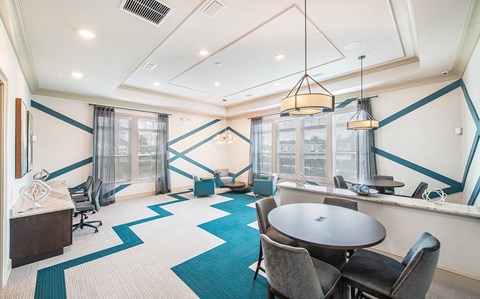 a conference room with blue and white walls and a table and chairs