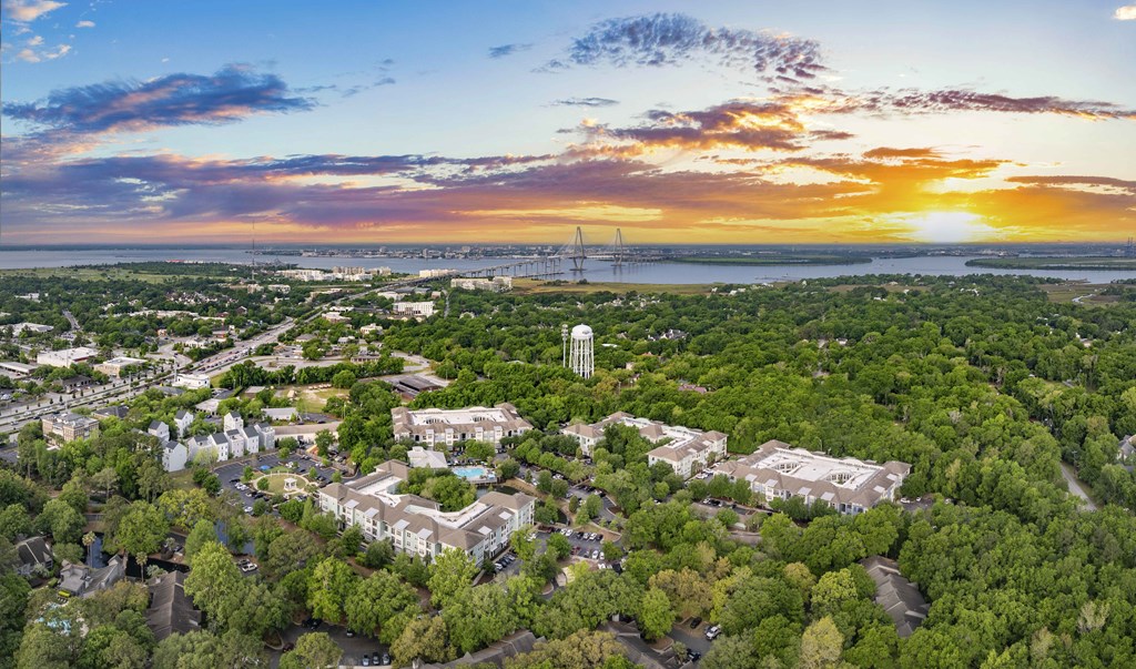 an aerial view of the city at sunset