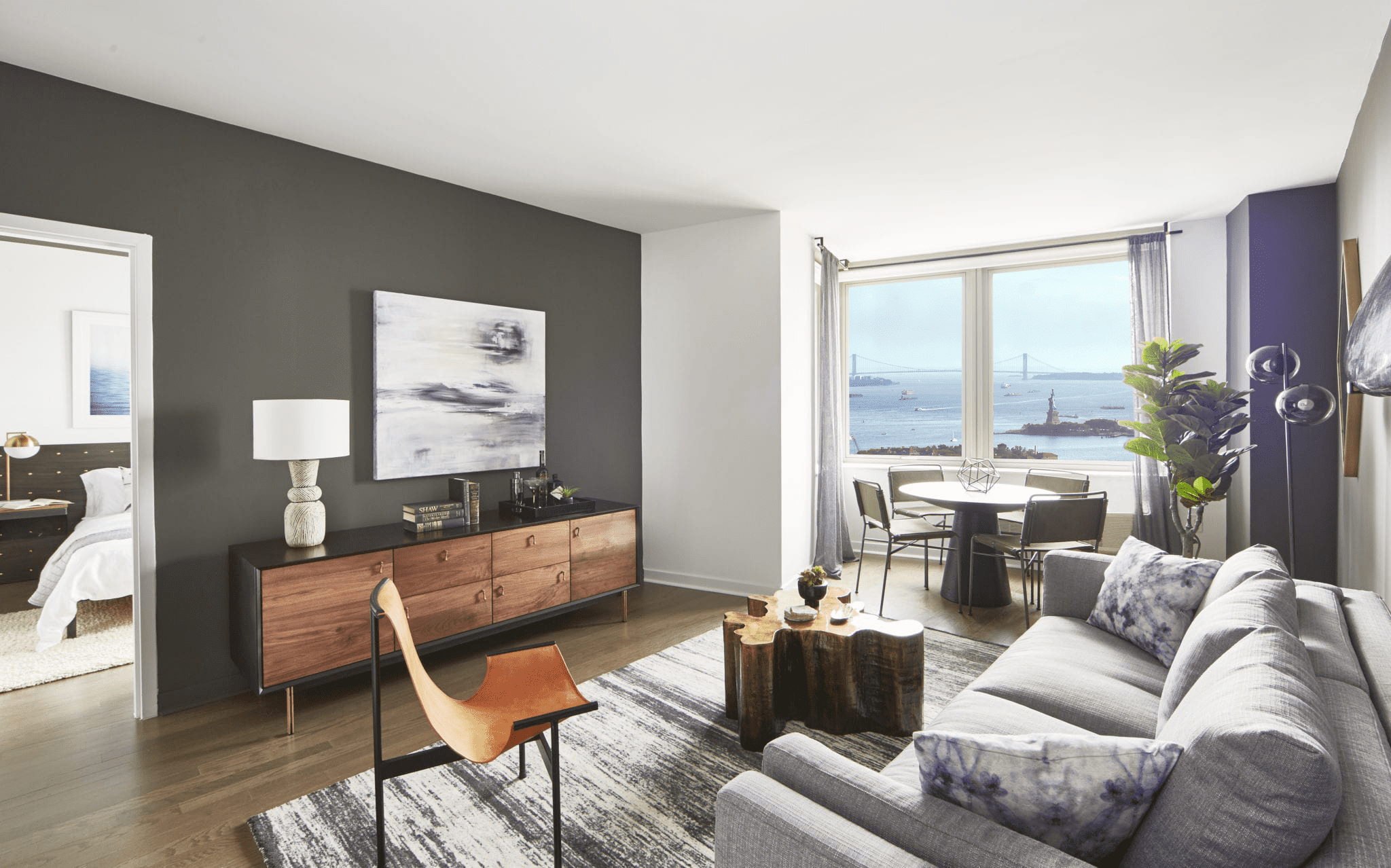 a living room with a couch and a table and a window