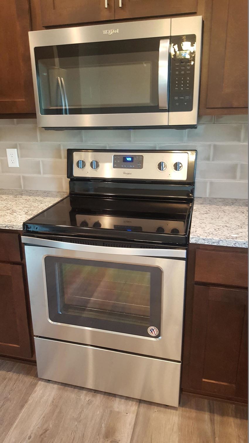 a kitchen with a stove and a microwave