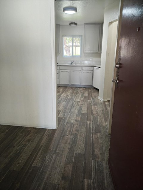 A kitchen with a sink and a window.