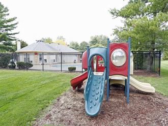 a childrens playground with a slide and a mirror