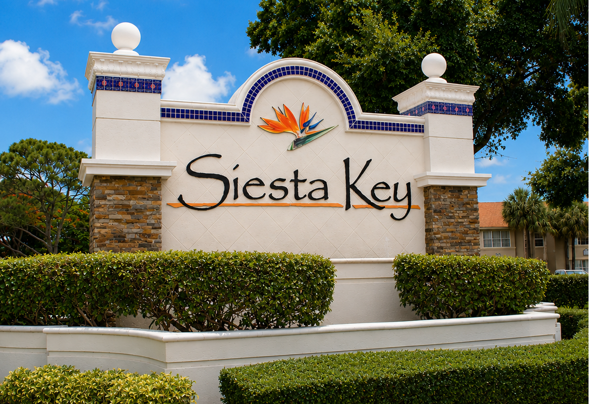 The image shows a sign for Siesta Key with a sunflower logo.
