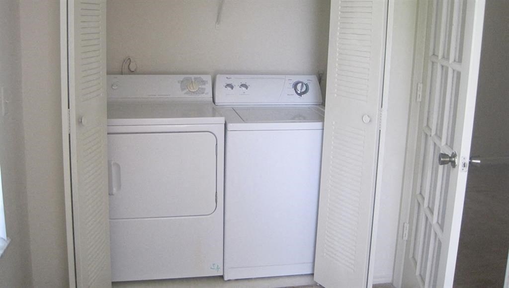 a laundry room with a washer and dryer in it