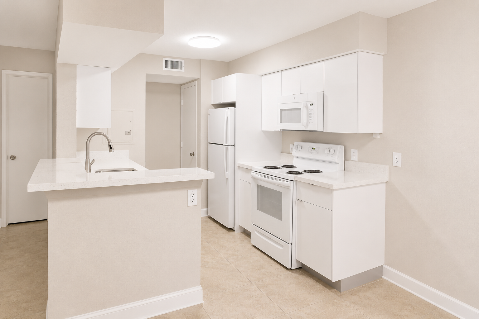 A white kitchen with a sink, stove, and refrigerator.