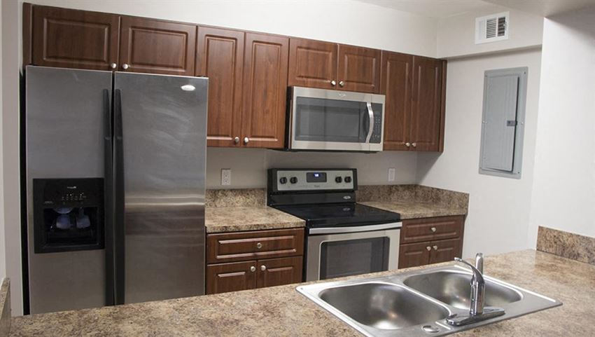 a kitchen with stainless steel appliances and a sink