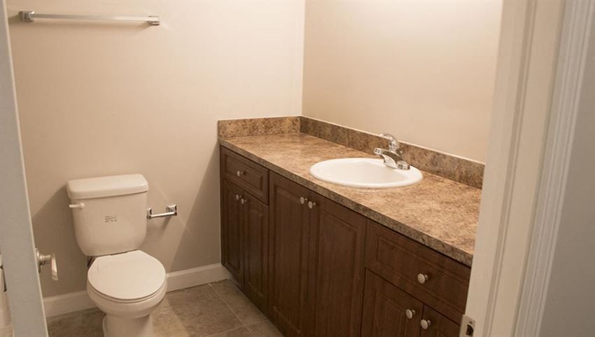 a bathroom with a toilet and a sink