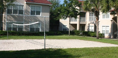 a volleyball court in front of an apartment building
