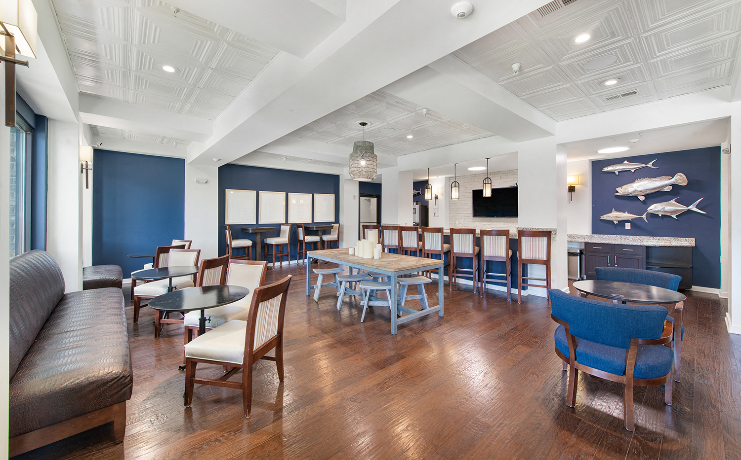 a dining room with tables and chairs and a fireplace