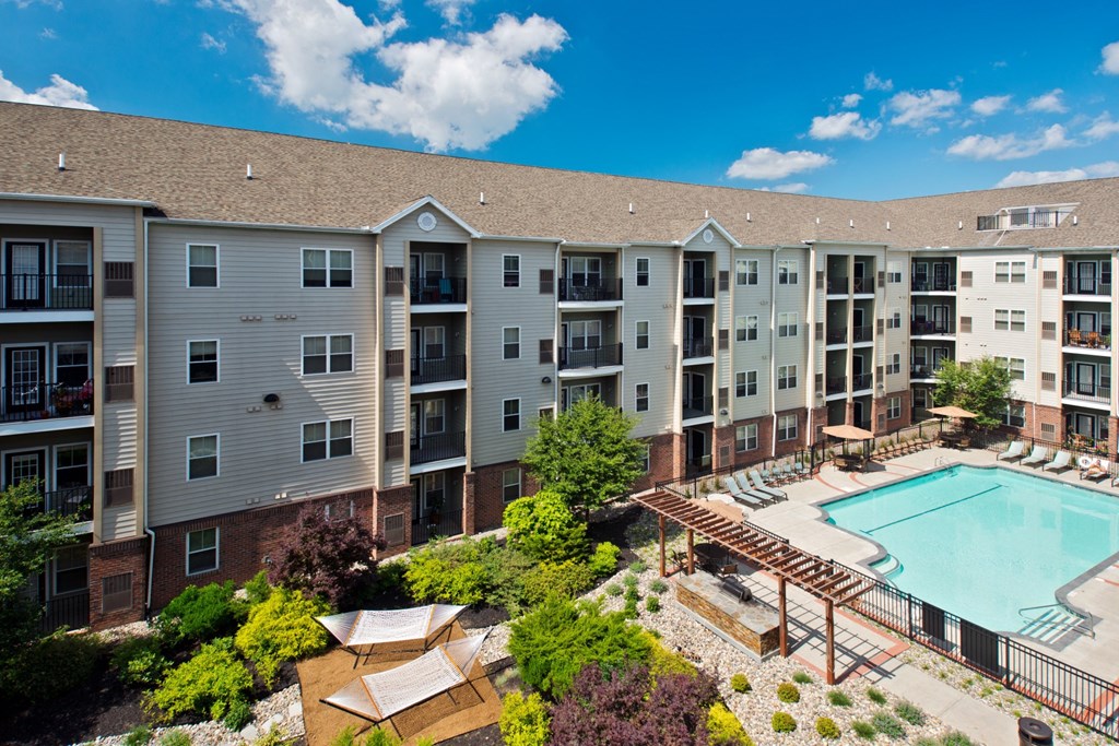 View of apartment complex and outdoor pool at Alexander at Patroon Creek, Albany