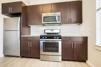 Fully Equipped Kitchen Includes Frost-Free Refrigerator, Electric Range, & Dishwasher at East Main, Massachusetts