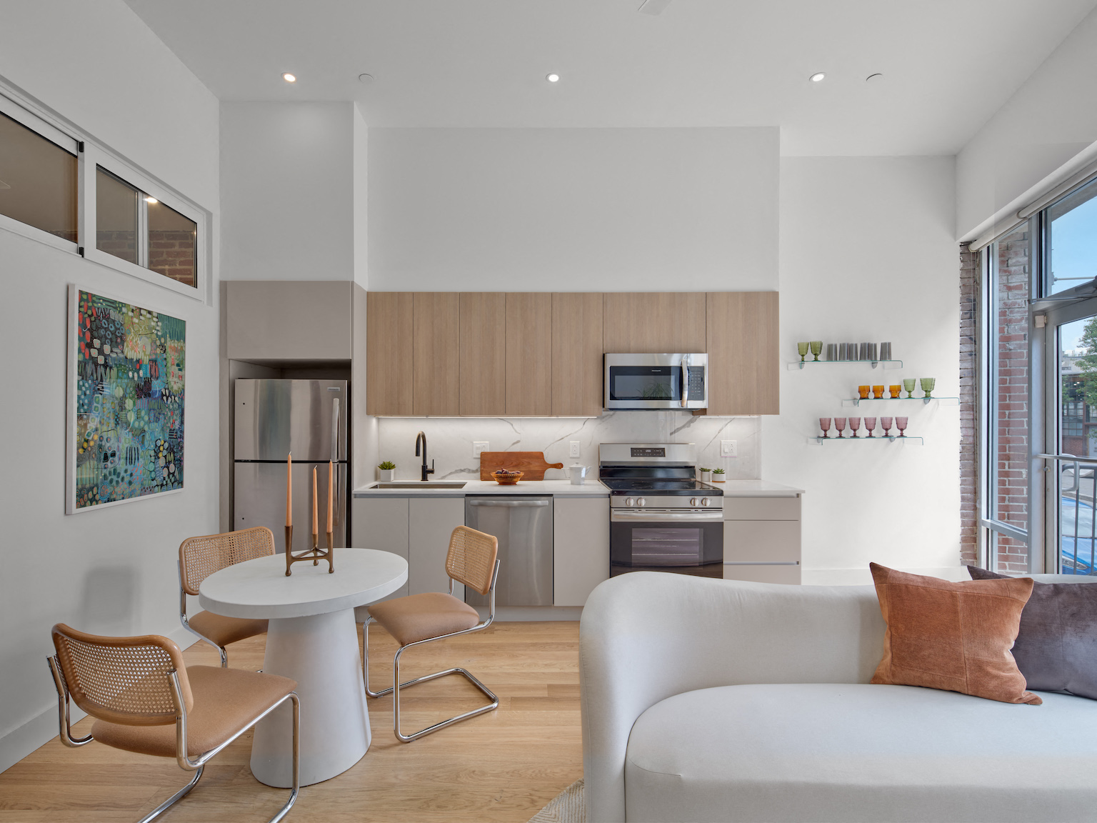 A modern kitchen with a dining table and chairs.