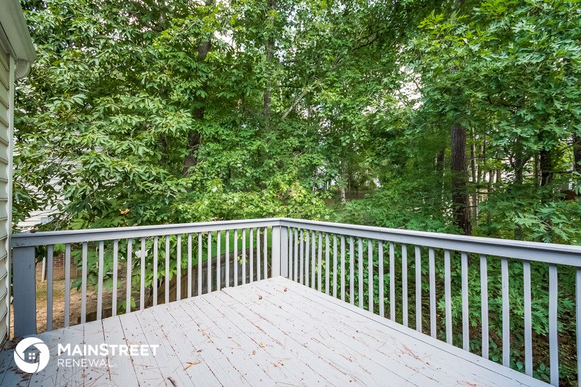 a deck with a view of the woods