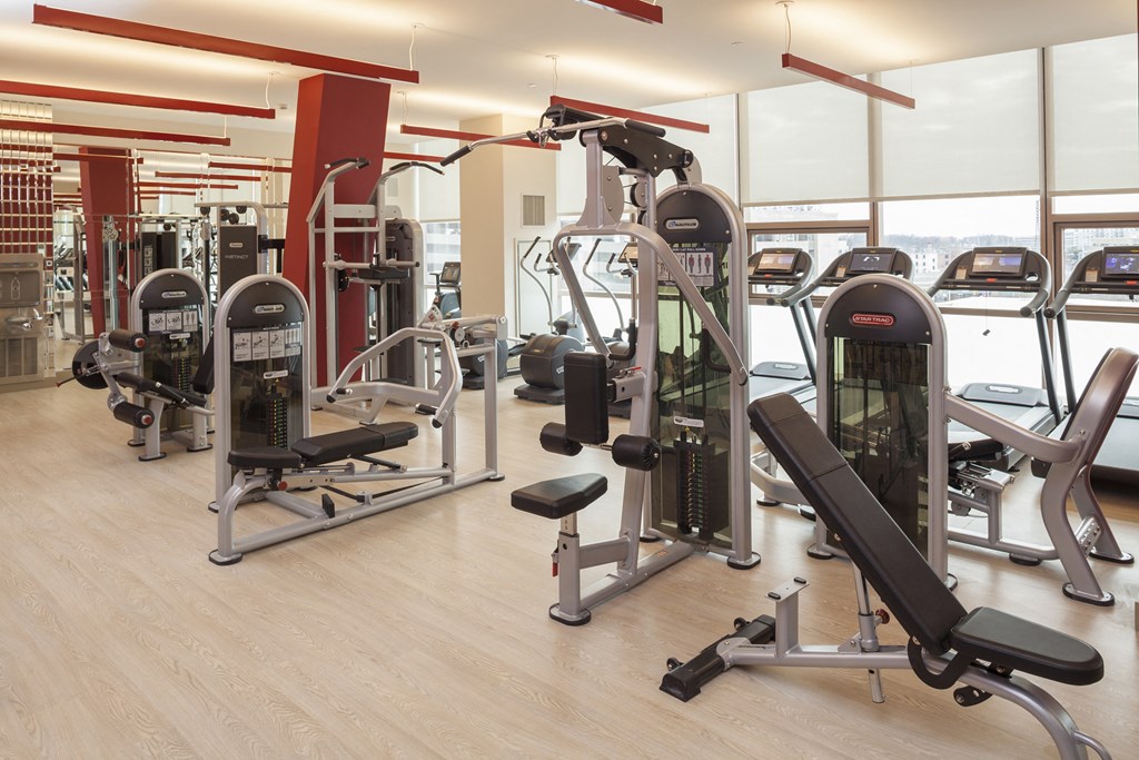 a gym with cardio machines and other exercise equipment