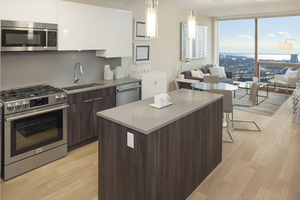 a kitchen and living room in a condominium