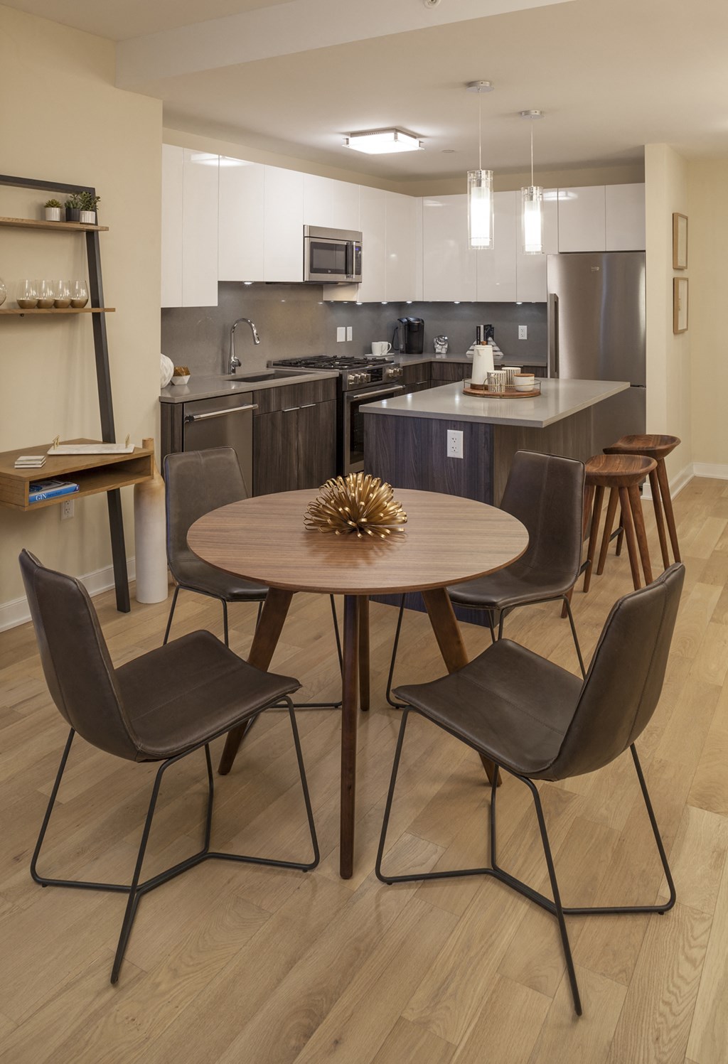 a kitchen and dining room with a table and chairs