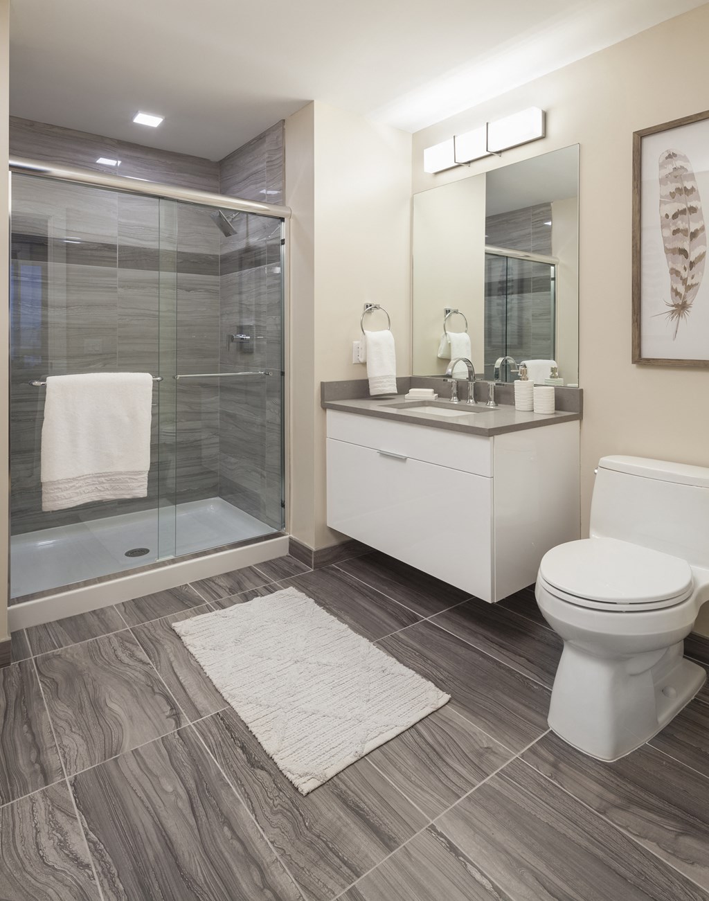 a bathroom with a toilet sink and shower