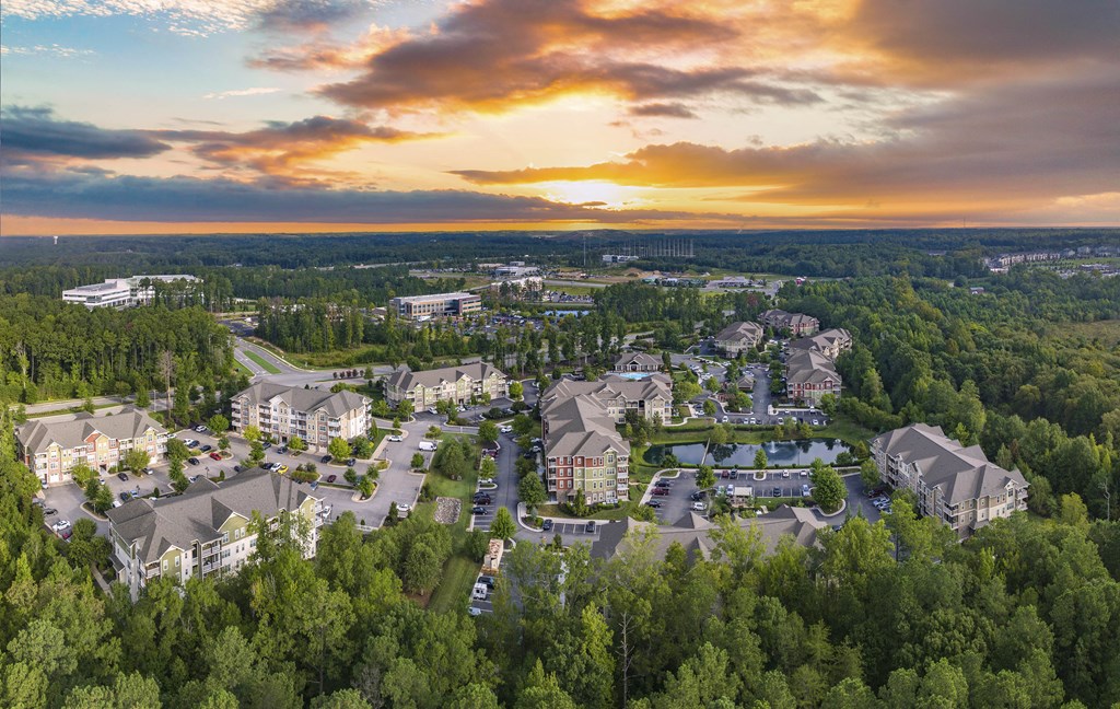 an aerial view of a city with houses and trees