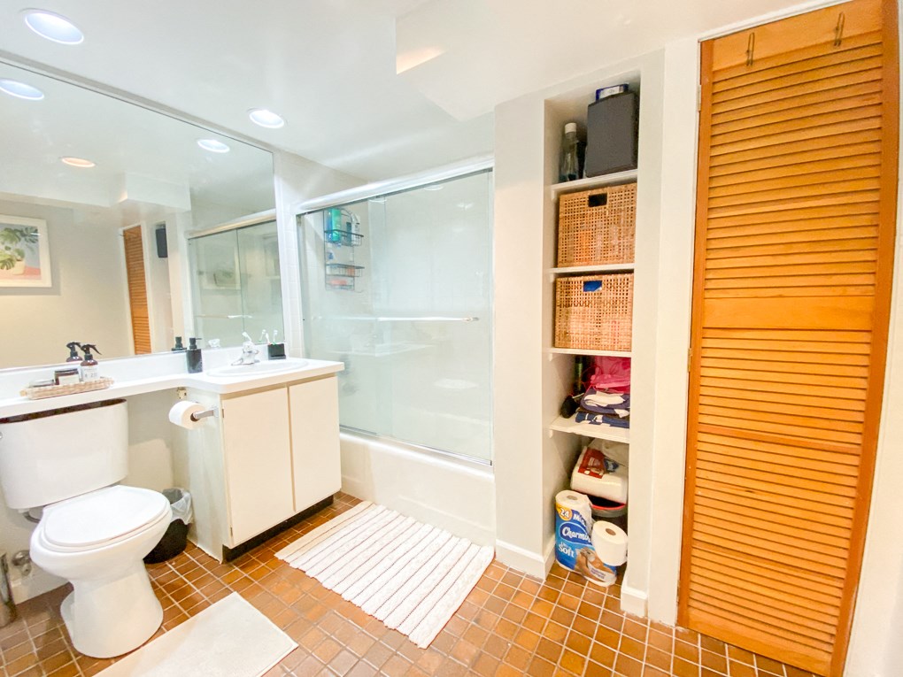 a bathroom with a toilet sink and a shower