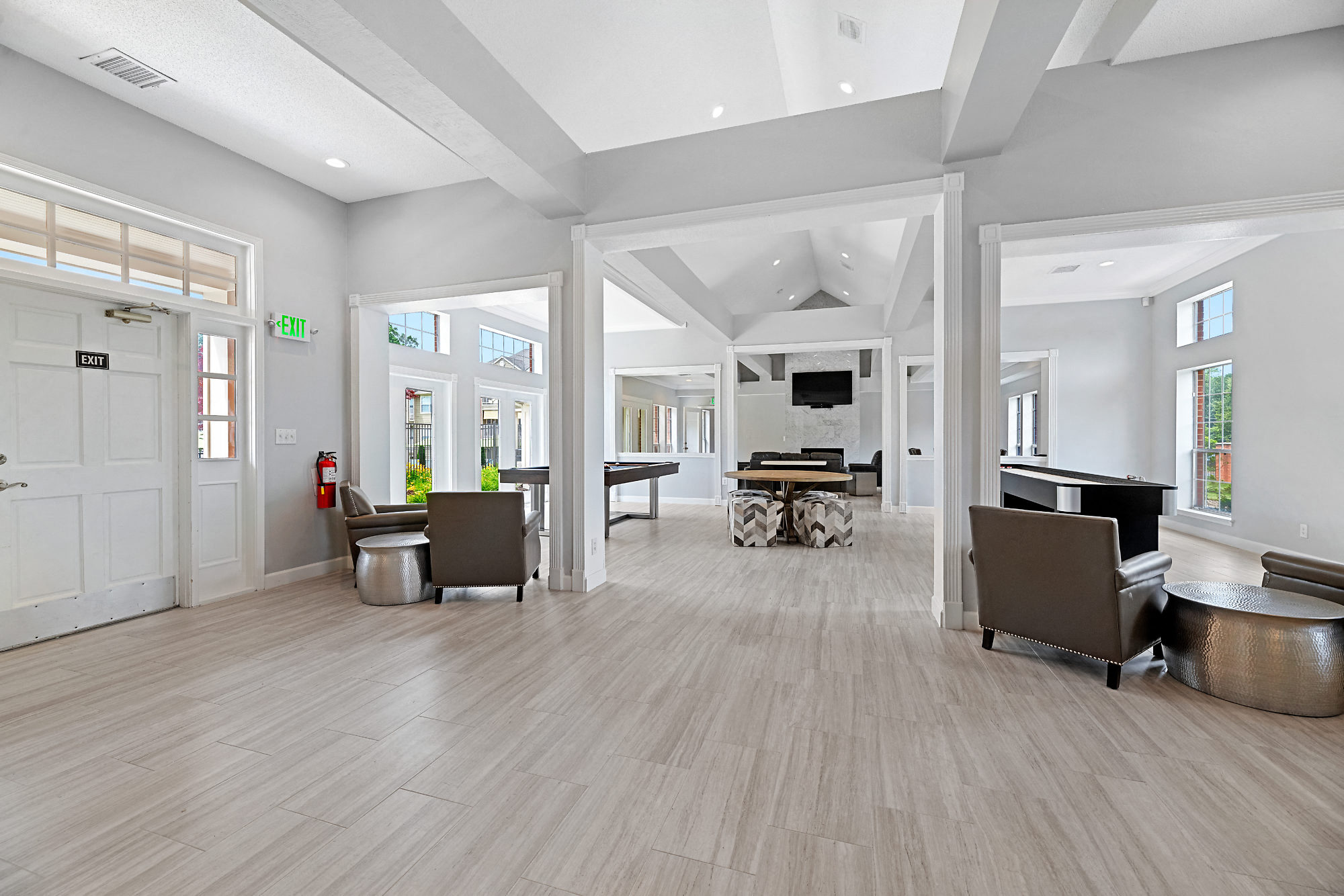 the living room of a new home with furniture and a piano