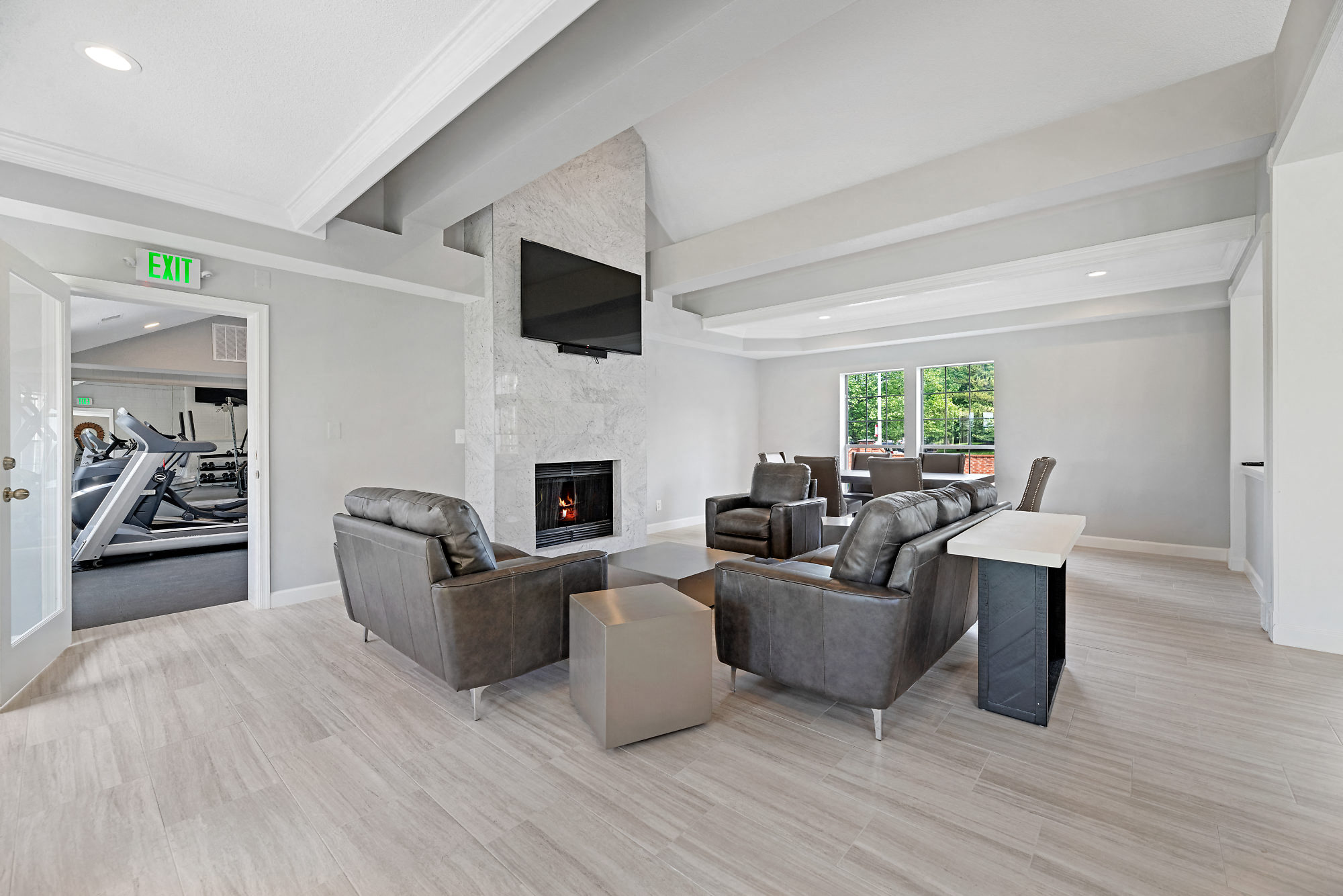 the retreat apartments l living room with fireplace and couches