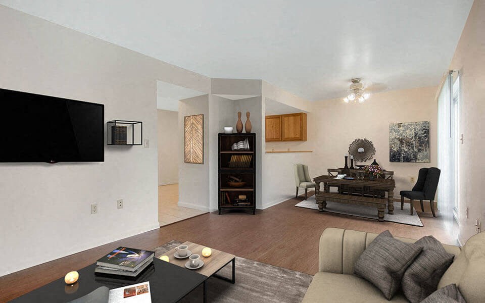 a living room with a couch and a table and a television