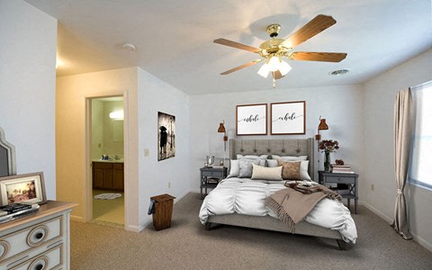 a bedroom with a bed and a ceiling fan