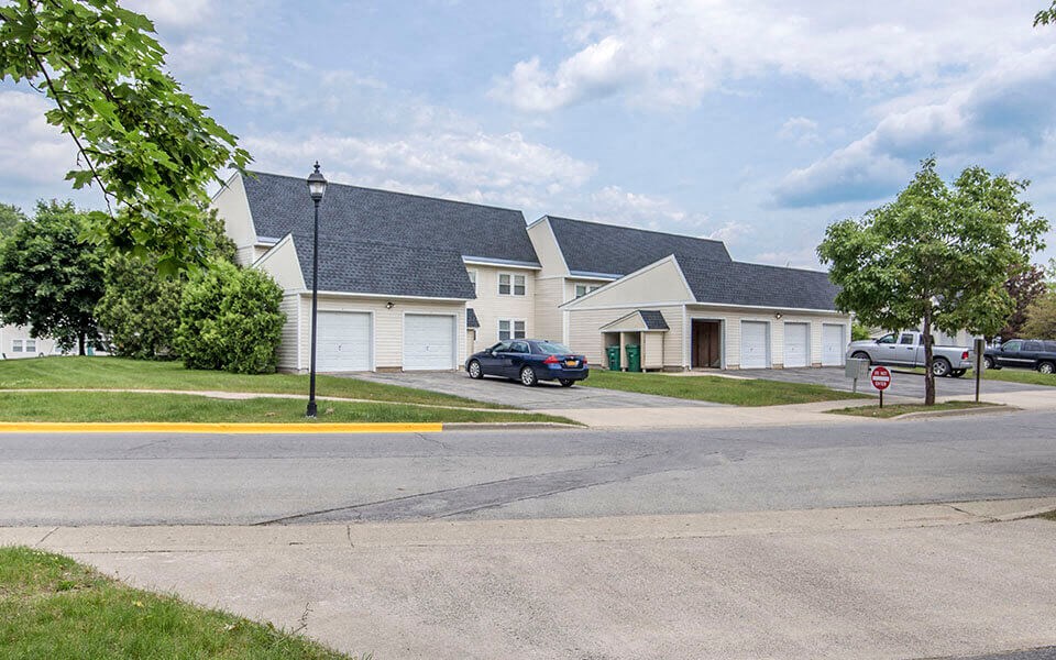 a row of houses on the corner of a street