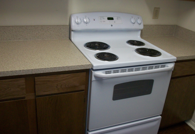 a white stove top oven in a kitchen