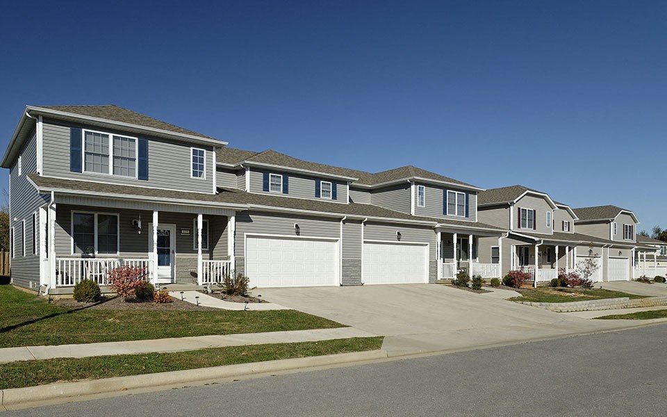 a row of houses on the side of a street