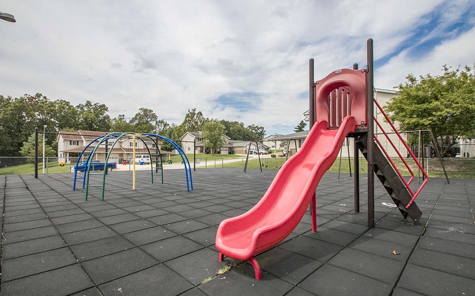 a slide at a playground in a park