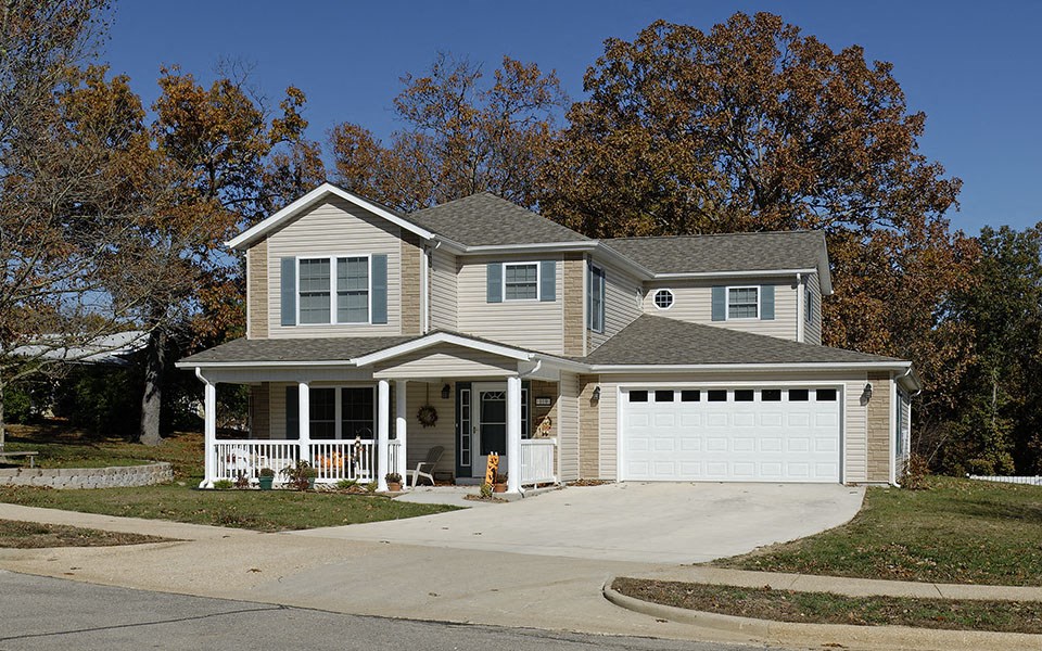 a white house with a white garage door