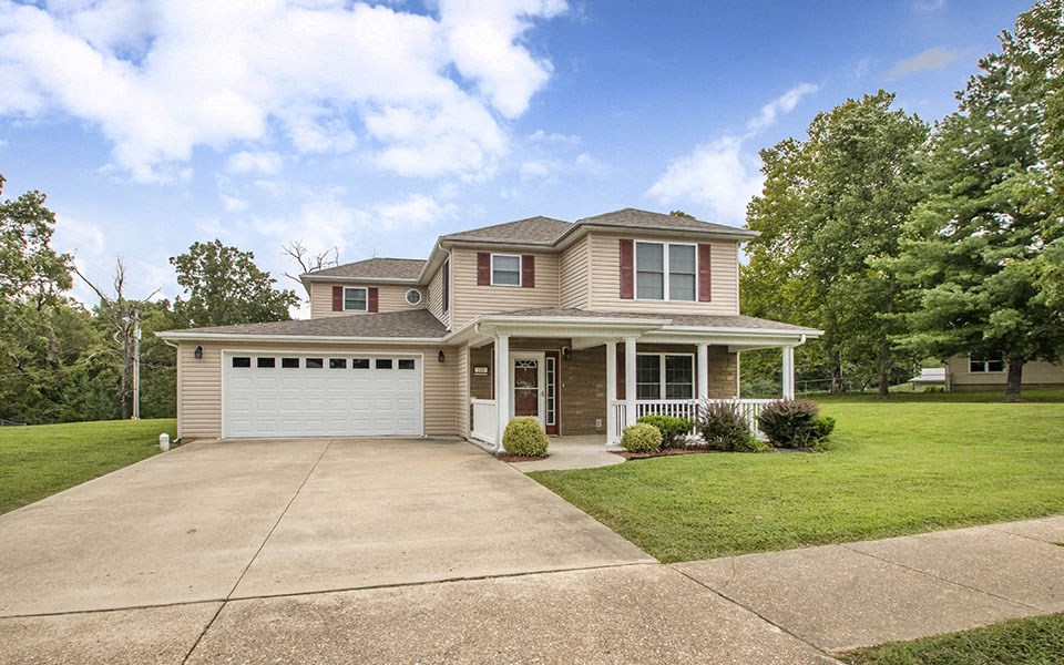 a house with a driveway and a garage door