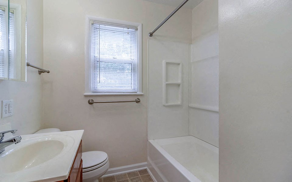 a bathroom with a sink toilet and a shower
