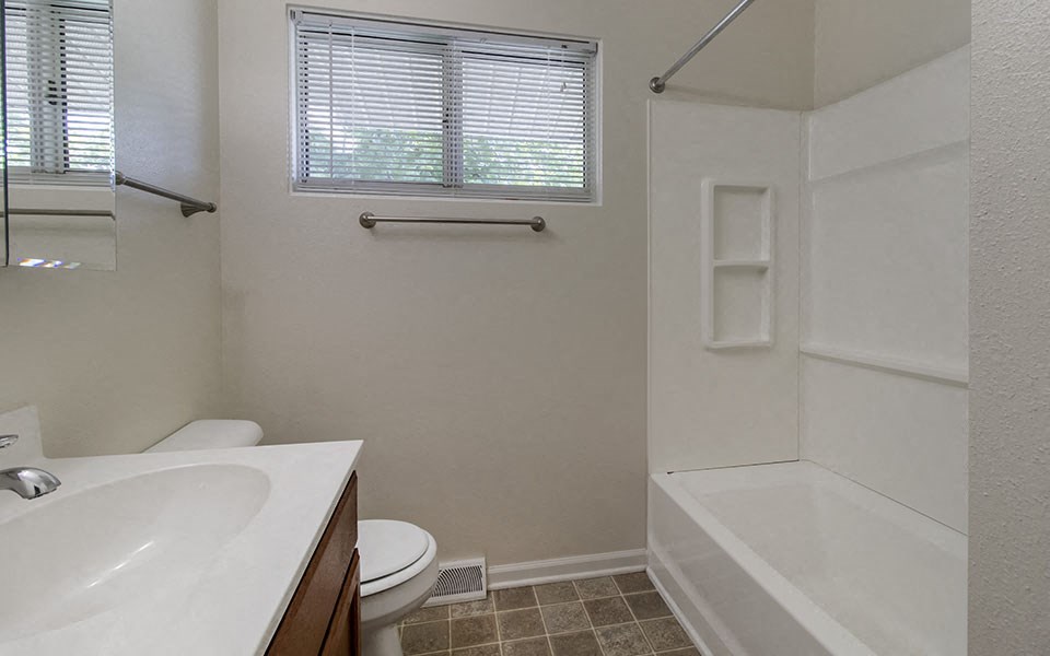 a bathroom with a sink toilet and a shower