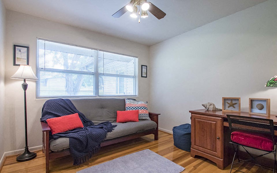 a living room with a couch and a window