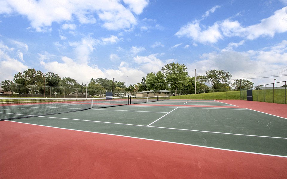 a tennis court with two nets on it