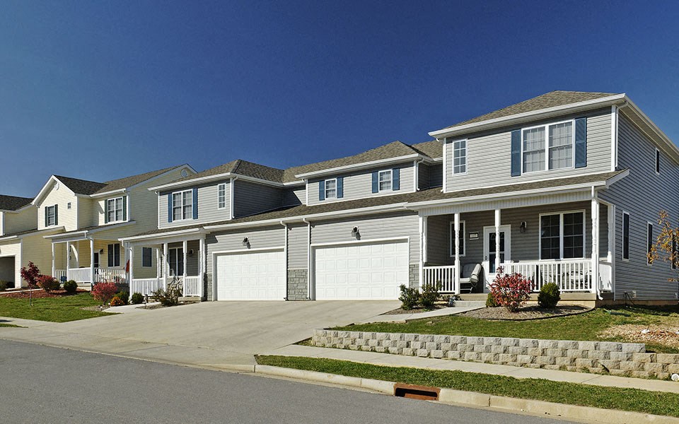 a large house with a street in front of it