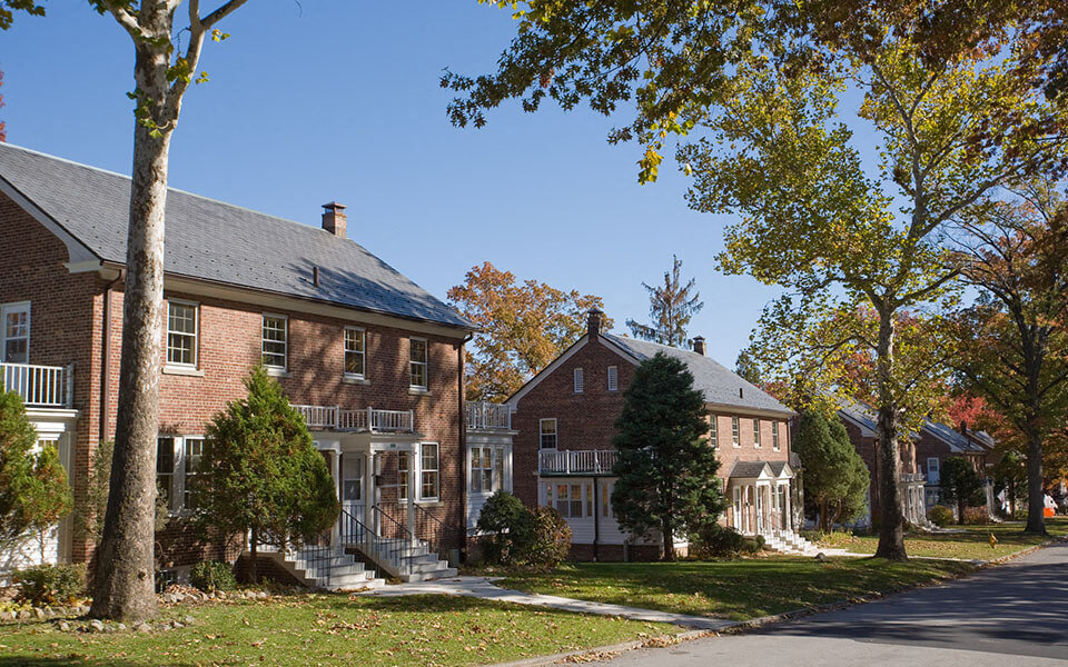 a row of houses on the side of a street