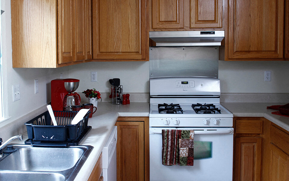 a kitchen with a stove and a sink