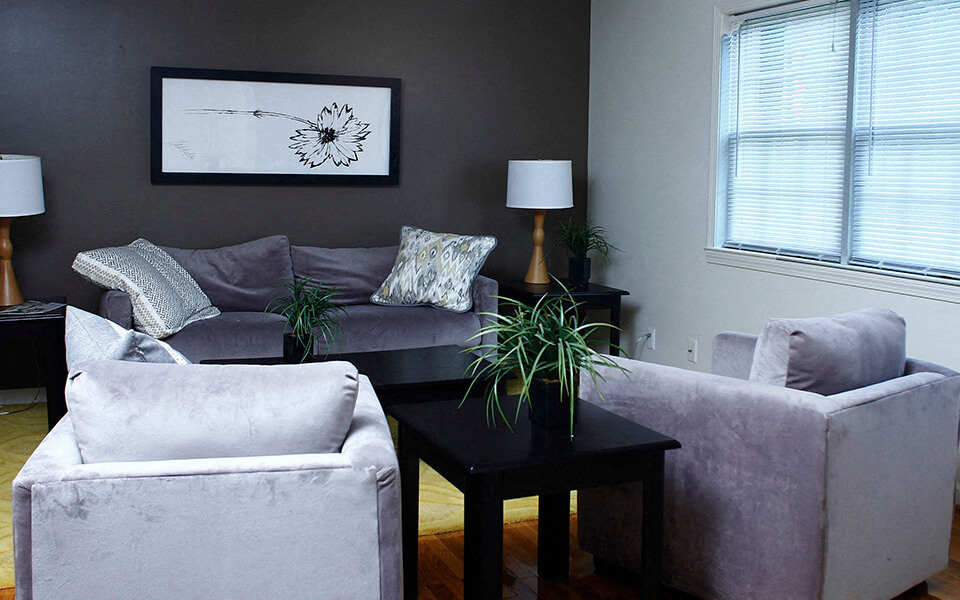 a living room with two couches and a table