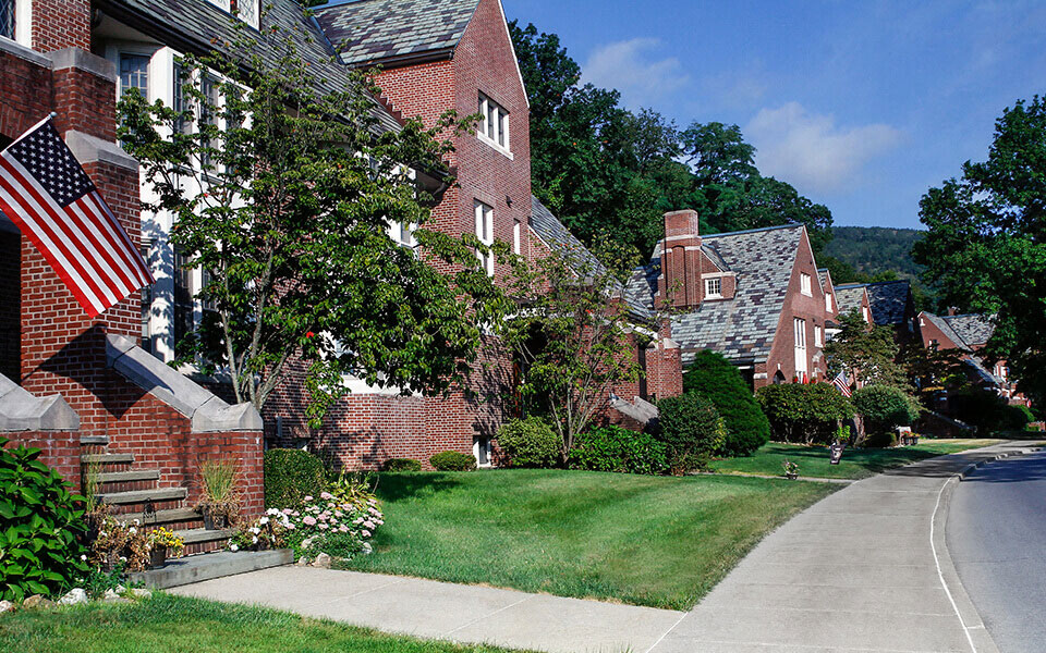 a row of houses with an flag in front of them