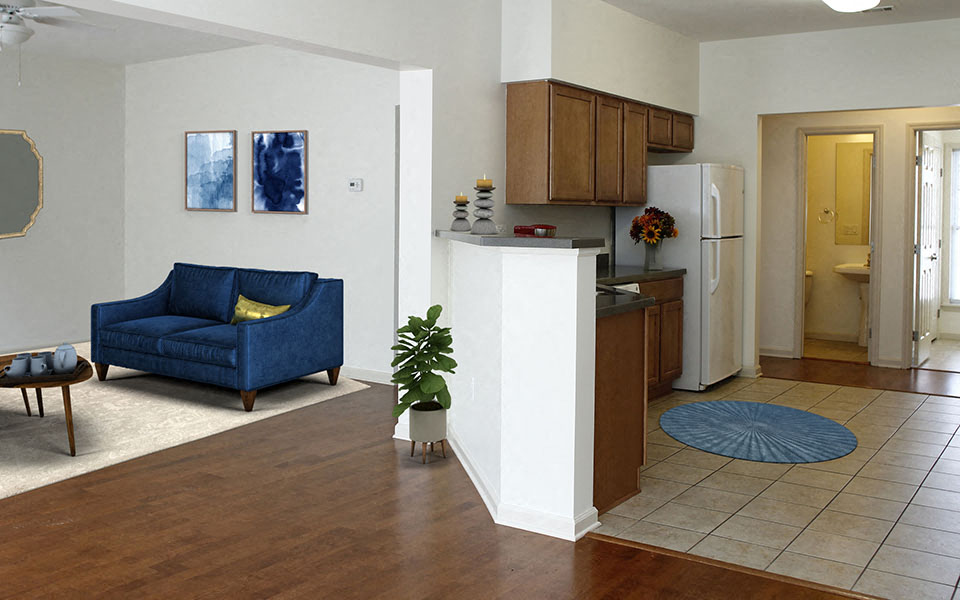 a living room and kitchen with a blue couch