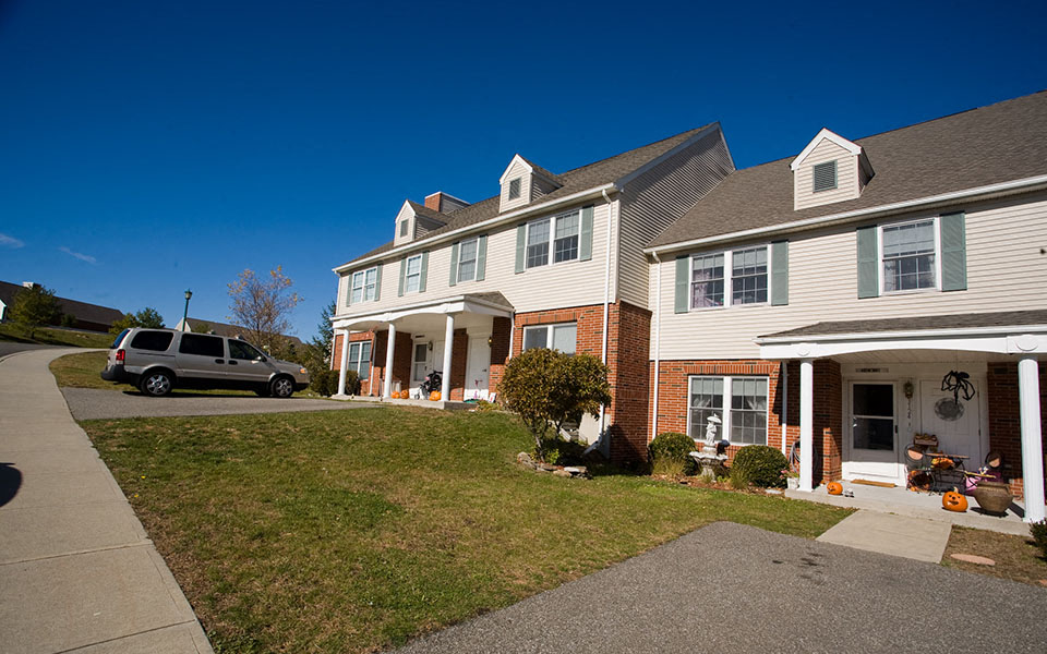 a house with a truck parked in front of it