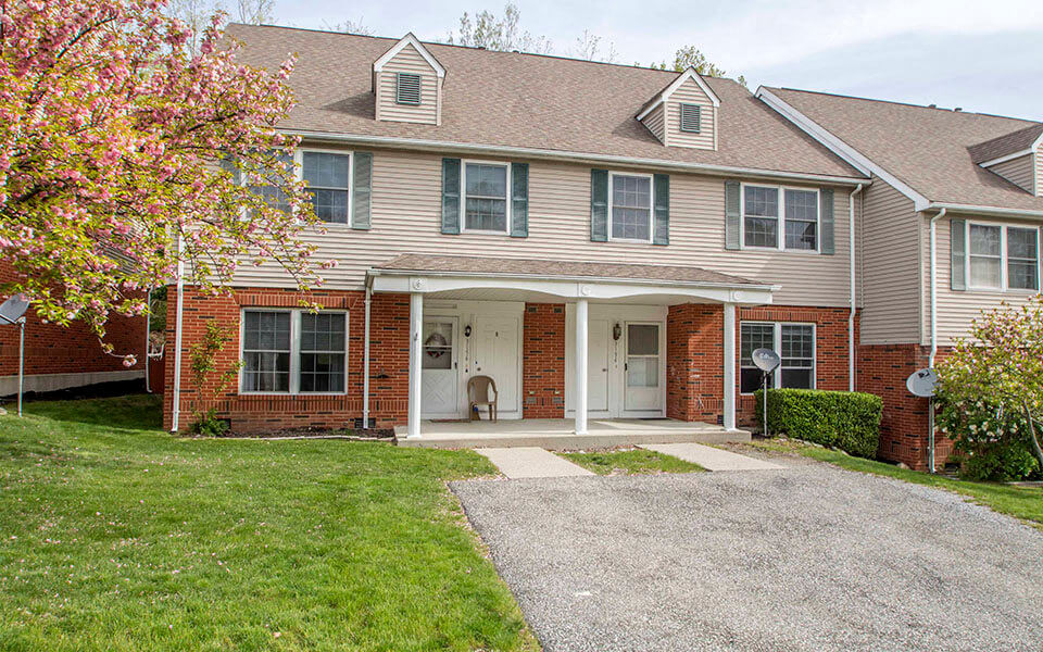 a large house with a driveway in front of it