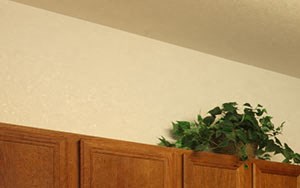 MarnePoint a kitchen with a stove microwave and cabinets