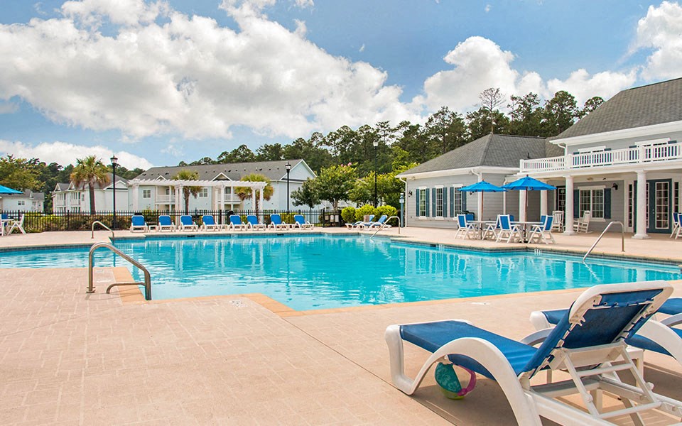 the swimming pool at the resort on a sunny day