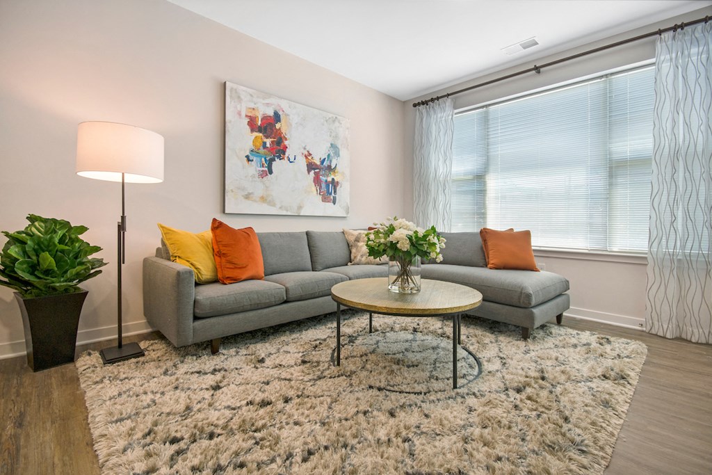 a living room with a couch and a round table